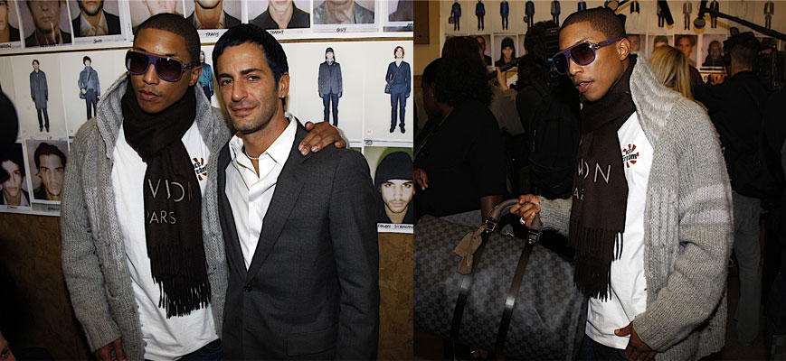 Marc Jacob’s Muse; Hip-hop Rap Star and Producer Pharell Williams at Men’s Fashion Week First Class Fashionista would like to invite you to shop: Discount Designer Clothes Discount Designer Shoes Discount Designer Handbags *BOOKMARK THIS SITE for Updates* Celebrity Fashionista Pharell looking demure and...