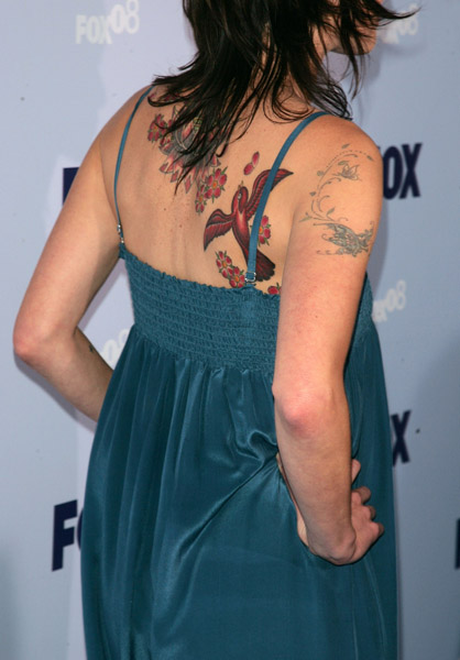 Close Up Of Lena Headey's Bird and Flower Back Tattoos