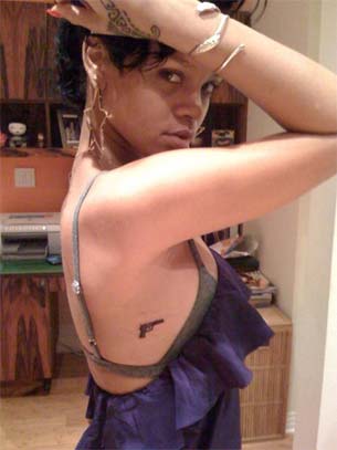 rihanna pictures of chris brown beating. Rihanna Gets a Tattoo of A Gun