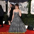Tina Fey Poses on the Red Carpet of the 2010 Golden Globe Awards. Tina Fey’s red carpet hairstyle and dress at the 67th Annual Golden Globe Awards held at The...